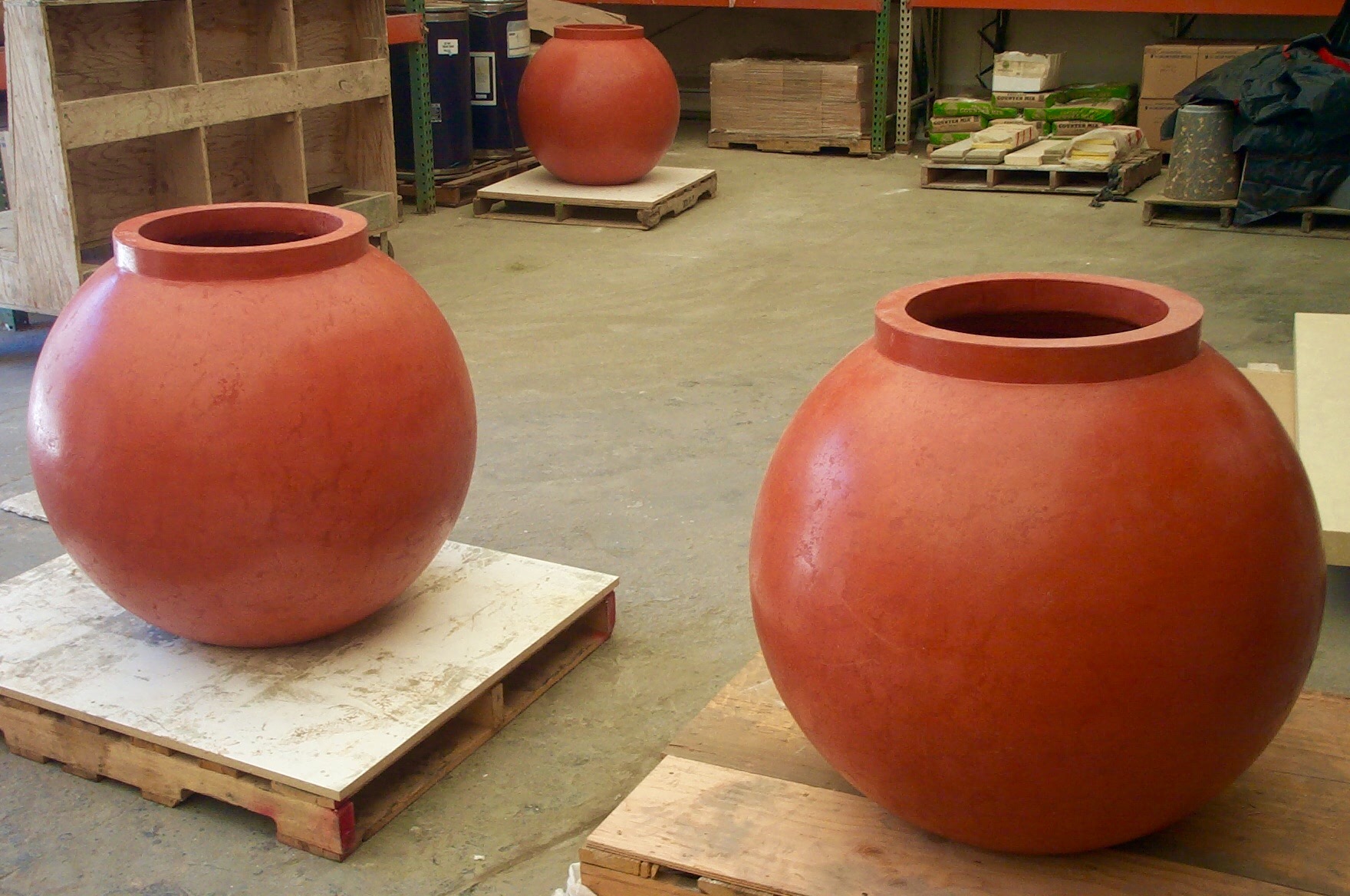 Concrete sphere planters in production
