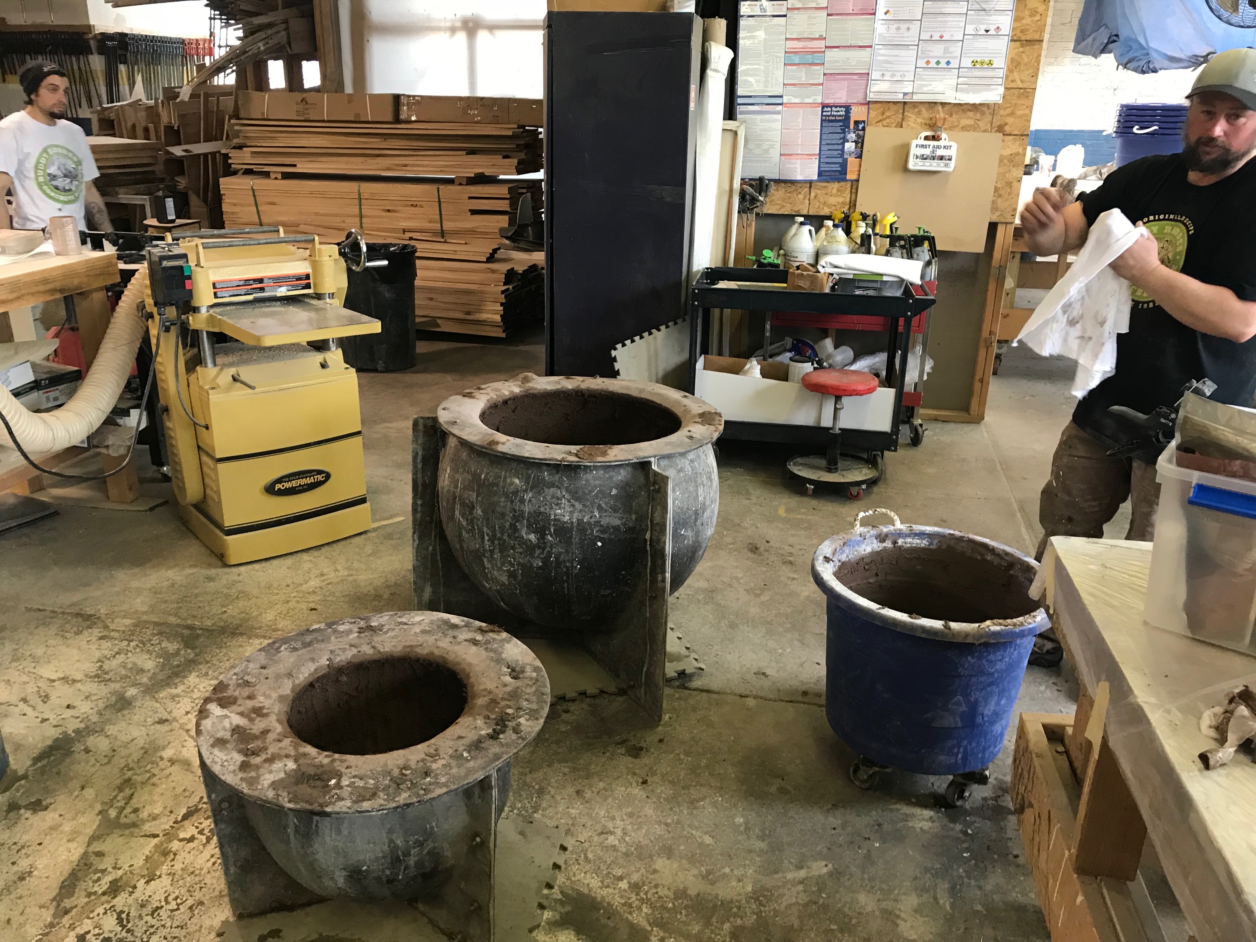 Workers finishing a large planter