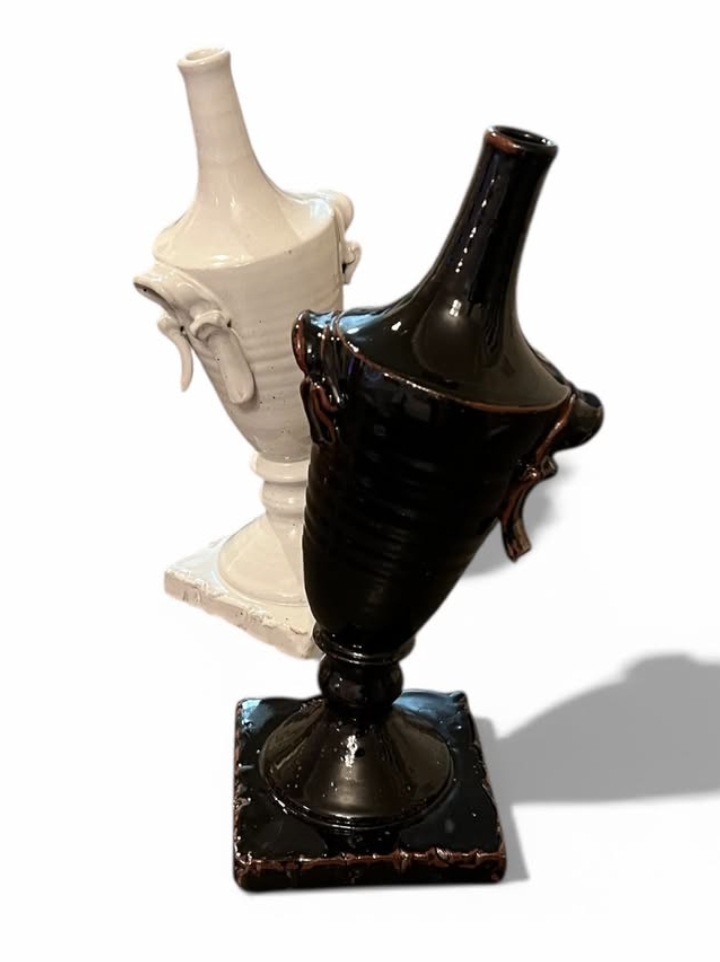 Black and white ceramic urn pair