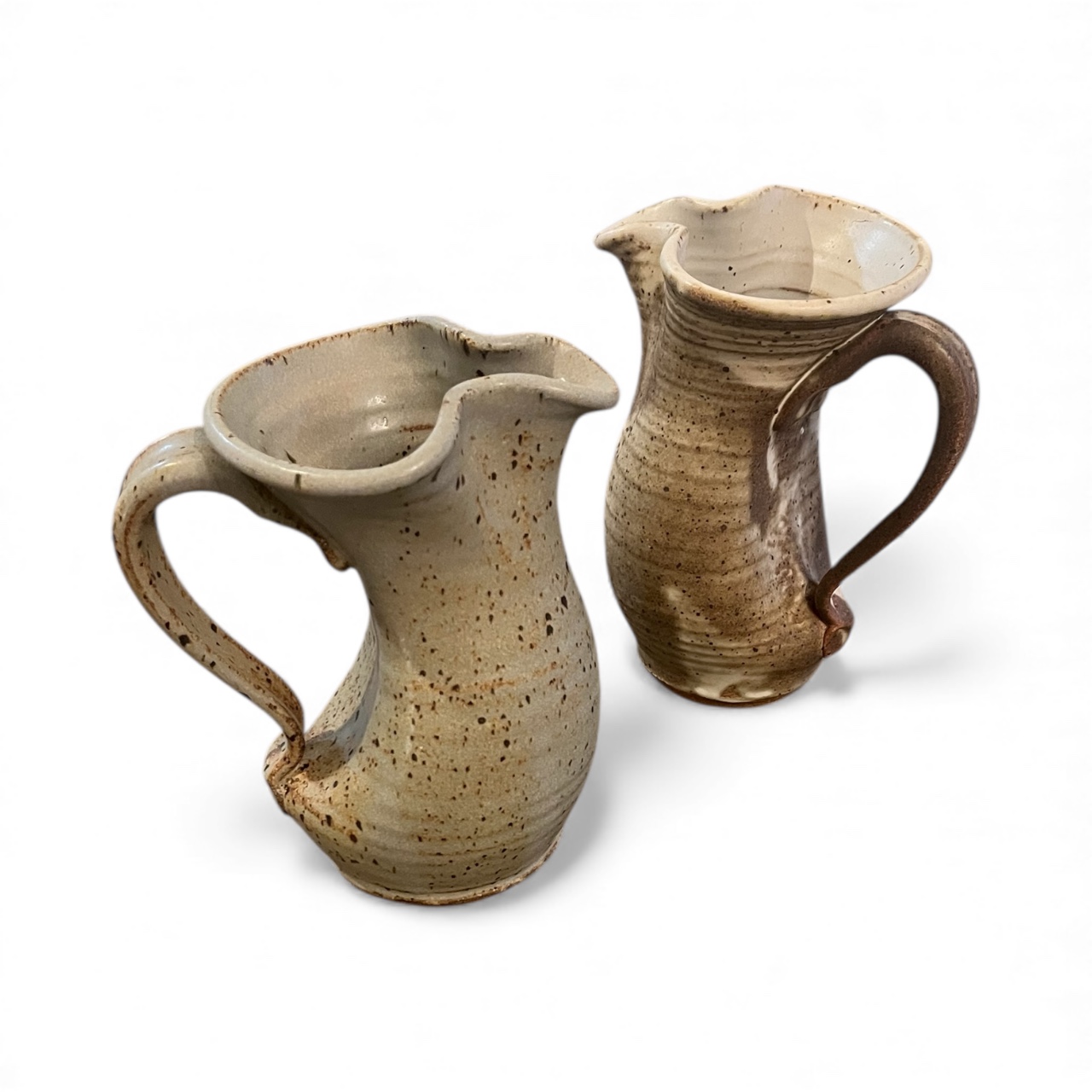 Speckled pitchers with ruffled rims